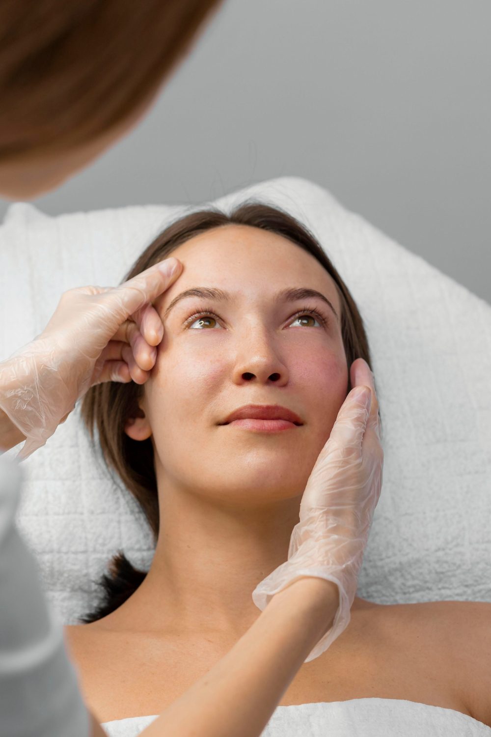 beautician-with-female-client-salon-face-care-routine beautician-with-female-client-salon-face-care-routine